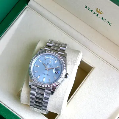 This is a Rolex Day-Date 40mm (reference 228396TBR) crafted in 950 platinum.