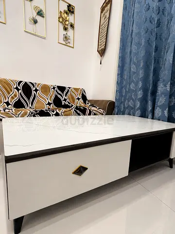 White marble-top coffee table with storage — good condition