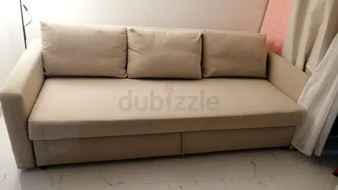 Beige 3-seater sofa bed in good condition