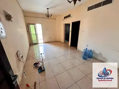 **Spacious two-bedroom apartment with a balcony for rent near Zulekha Hospital, Sharjah**, featuring