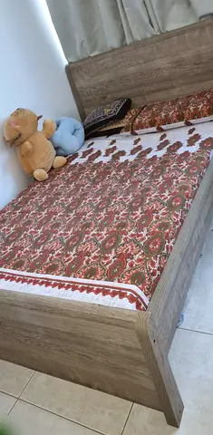 Twin wooden bed without mattress and bedsheet - good condition