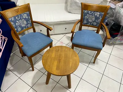 Pair of wooden armchairs with small round side table - good condition