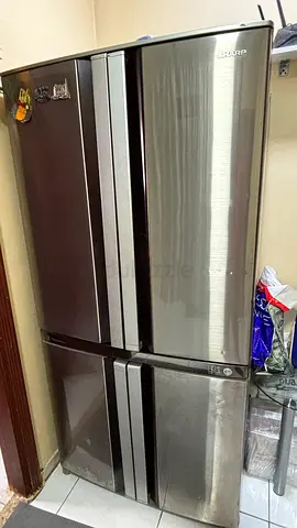 Sharp 4-Door Refrigerator - Stainless Steel Finish, Good Condition