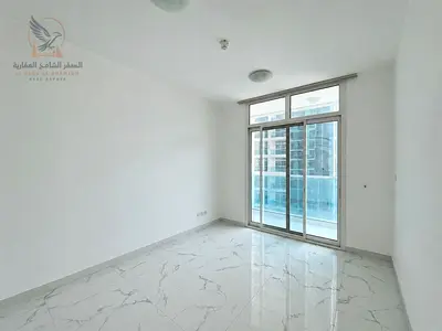 Annual rental apartment in Al Waha Towers, two master bedrooms, creek view, three balconies, free parking, gym and pool, prime location.