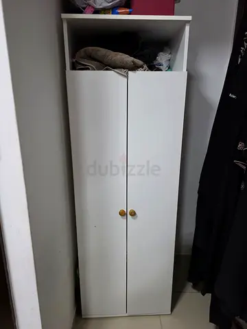 Slim white wardrobe with two doors and top shelf - good condition