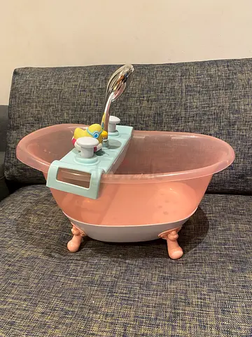 Baby doll bath tub with attached shower head good condition