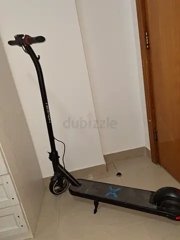 Barely used black electric Hover 1 scooter - single rider, foldable, charger included, and 5-20 mp