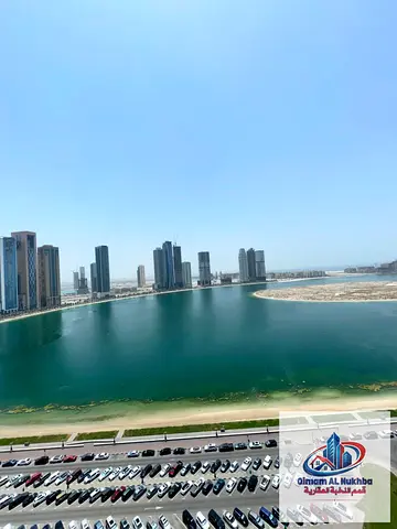 Spacious 2BR with panoramic living room, sea-view balcony, 4 bathrooms, maid’s room, large kitchen & built-in wardrobes.