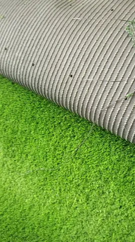 Used artificial grass turf roll - green outdoor carpet