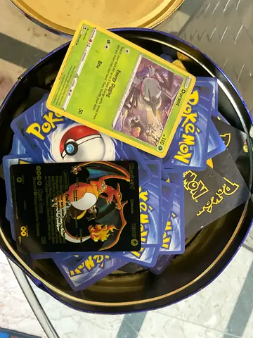 Collection of Pokémon Trading Cards including Charizard Gold Holo bulk set