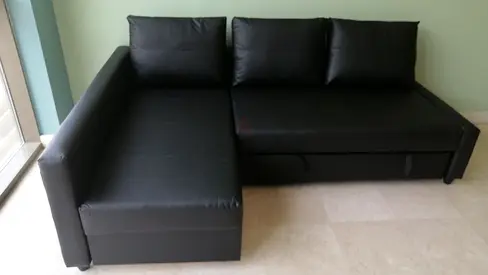 Black L-shaped Sofa Bed with Storage — Good Condition