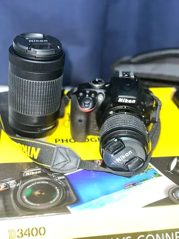 Nikon D3400 DSLR, like new, two original lenses, complete kit.”