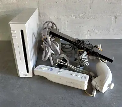 Nintendo Wii console with two Wii Remotes, Nunchuk and sensor bar - used