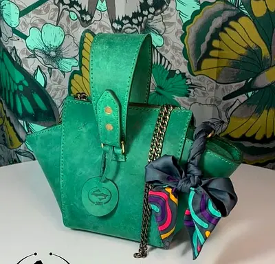 Green suede structured handbag with chain strap and scarf detail