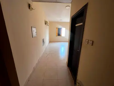 Spacious studio in Al Rawda 3, split AC, free maintenance, easy access to Dubai and Sharjah.