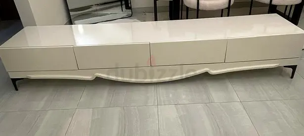 Low-profile modern white TV entertainment unit with storage