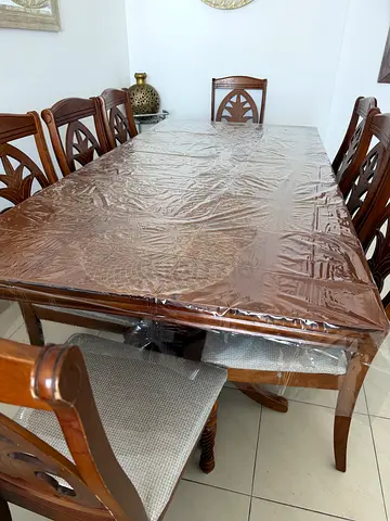 Solid wood 8-seater dining table with chairs - good condition