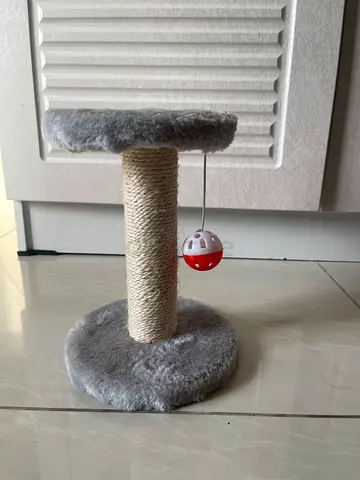 Small grey cat scratching post with toy