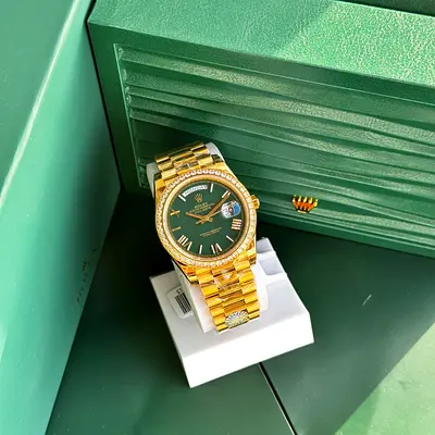 This is a Rolex Day-Date 40 (Reference 228348RBR), featuring a 40mm 18k yellow gold