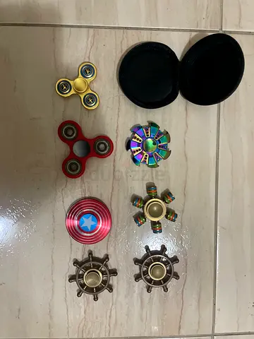 Lot of 8 assorted metal fidget spinners with carrying case
