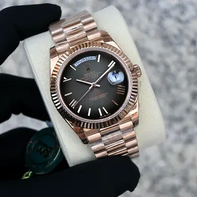 This is a Rolex Day-Date 40 in 18k Everose Gold featuring a slate ombré dial.