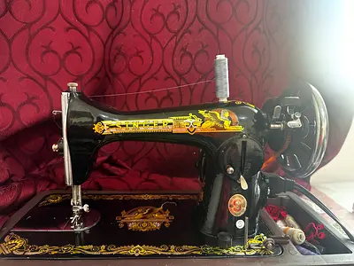 Singer shewing machine used few times to make dresses good condition no problems. In it.