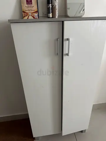 White two-door shoe cabinet