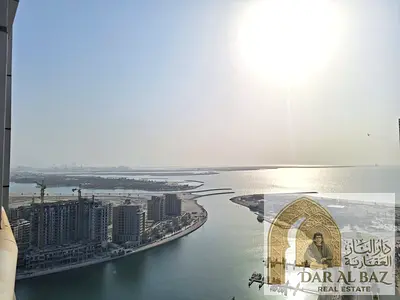 Apartment for annual rent in Al Khan area, Sharjah. The apartment has two bedrooms, parking, gym, swimming pool, built-in wardrobes, and a sea view.