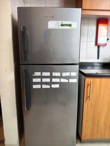 Whirlpool top-freezer refrigerator - stainless steel, good condition