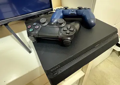 Sony PlayStation 4 Slim with 2 DualShock Controllers - Good Working Condition 1TB
