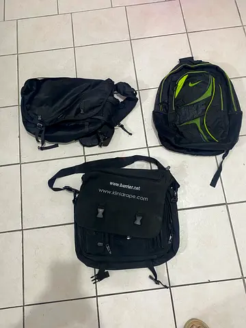 Three mixed black backpacks and sling bag - used, good condition