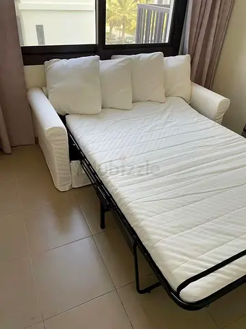 White 2-Seater Sofa Bed with Pull-Out Mattress - Good Condition