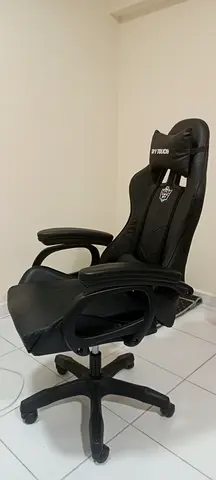 Used black gaming/office swivel chair with headrest and armrests