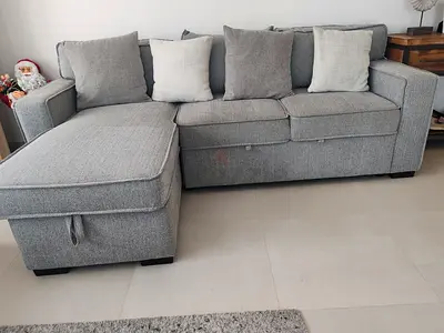 Light grey L-shaped sofa with matching TV unit - good condition