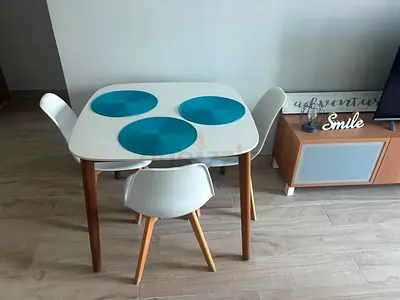 Compact Scandinavian-style dining table with 3 chairs - white & wood