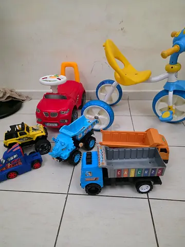 Mixed toddler ride-on and toy trucks set - used, good condition