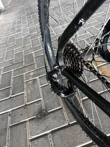 Used adult road/commuter bicycle - rear wheel and gears shown, good working condition