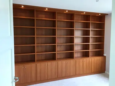 Large Built-in Wooden Bookcase with Lower Cabinets