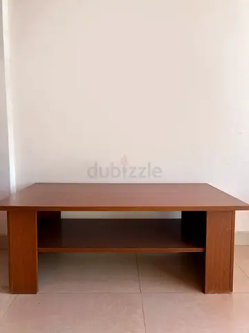 Simple wooden coffee table with lower shelf - good condition