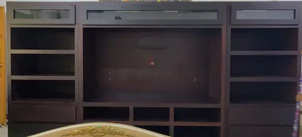 Large dark wood entertainment center / TV unit with shelving