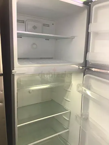 Used double-door refrigerator freezer (top freezer + fridge) - good condition