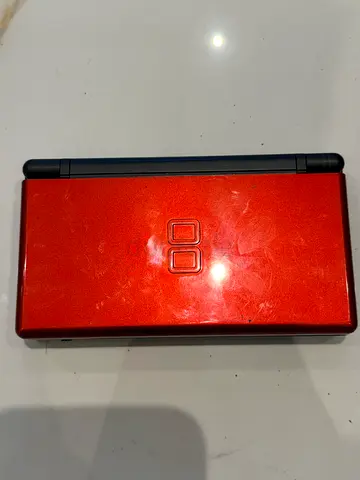 Red Nintendo DS Lite handheld console - used