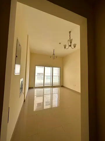 Apartment for rent in Al Nahda, Sharjah: 2 master bedrooms, living room, kitchen, 2 bathrooms, and