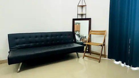 Black faux leather fold-out sofa bed / daybed - good condition