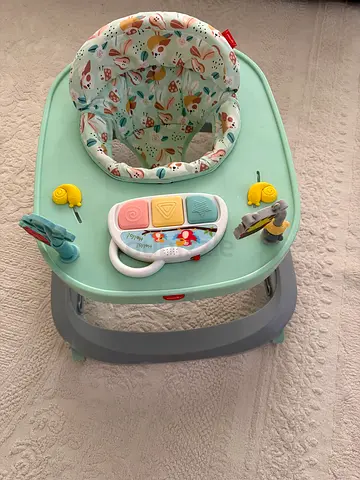 Gently used baby activity jumper/walker with toys - mint green