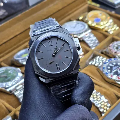 his is a Bvlgari Octo Finissimo Automatic watch featuring a black ceramic case and matching bracelet