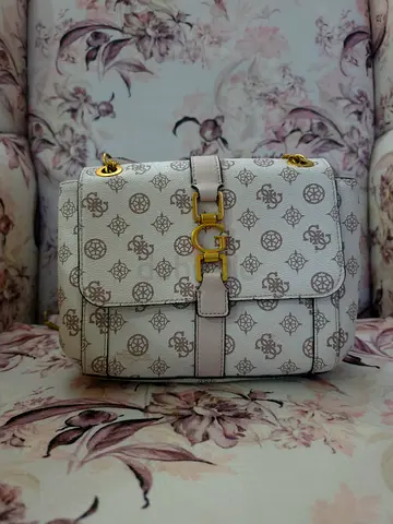 White patterned crossbody bag with gold hardware