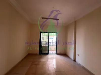Two bedroom apartment and living room for annual rent in Al Qasimia Al Nad Sharjah spacious layout balcony open view modern finishing prime location