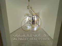 An affordable two-bedroom apartment with a living room, balcony, and hallway is available in Sharjah