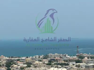 For annual rent: A luxurious four-bedroom apartment with a living room in Al Majaz 3, offering a full sea view.